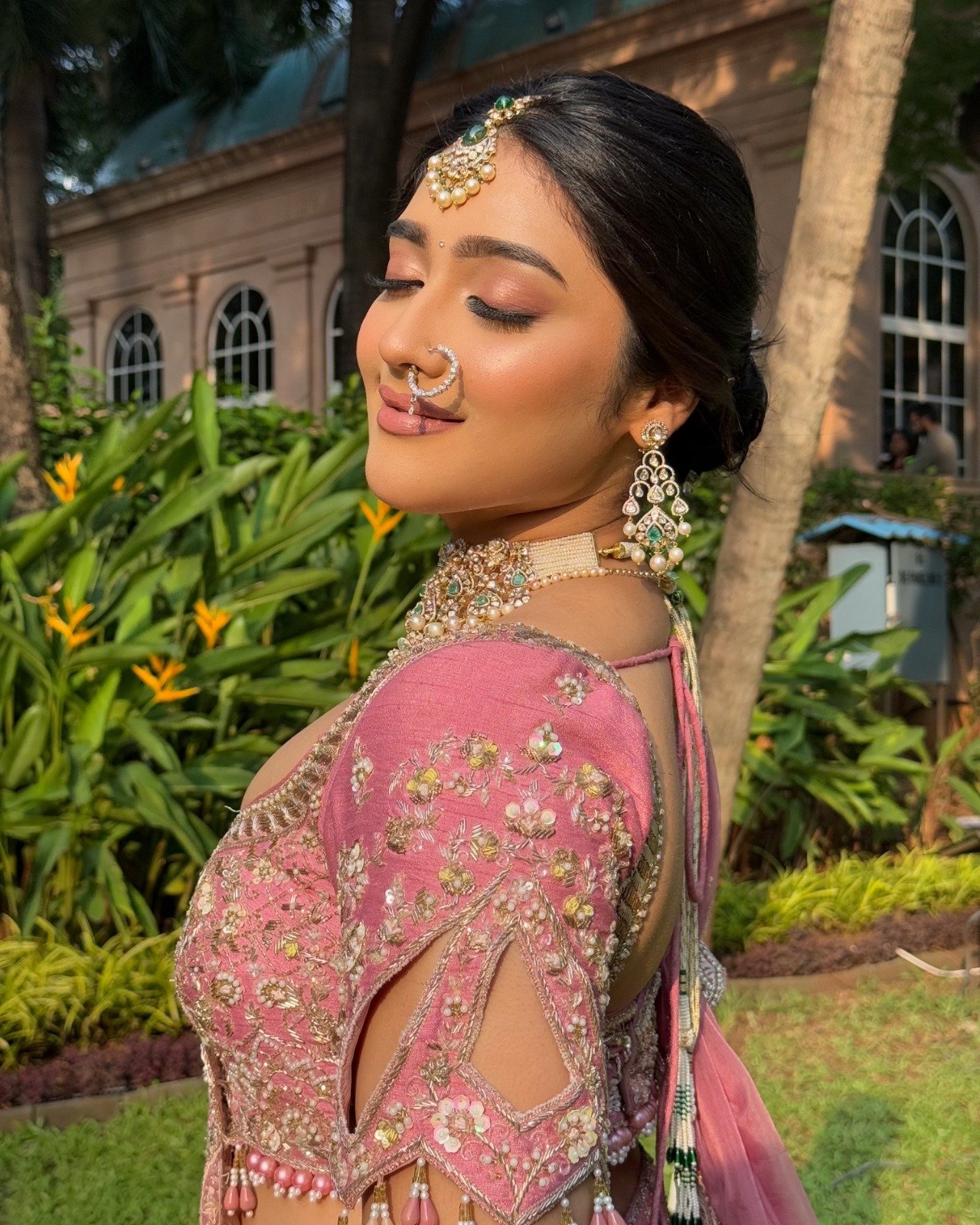 Bride in a pink lehenga with polki jewellery, bridal makeup by Tejaswini priced from Rs 50,000 per look