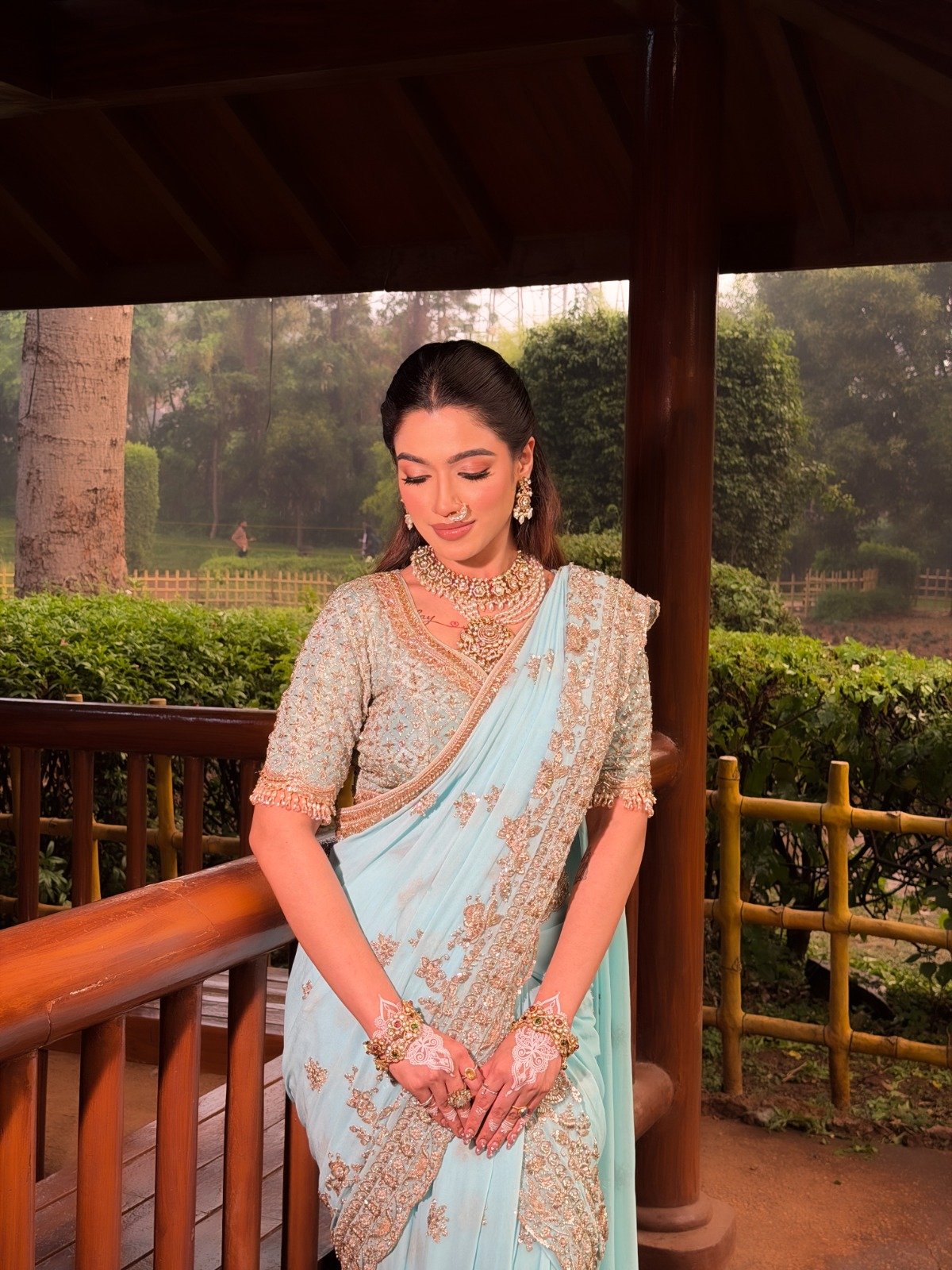 Bride in mint and gold with reception makeup and hairstyling by Tejaswini