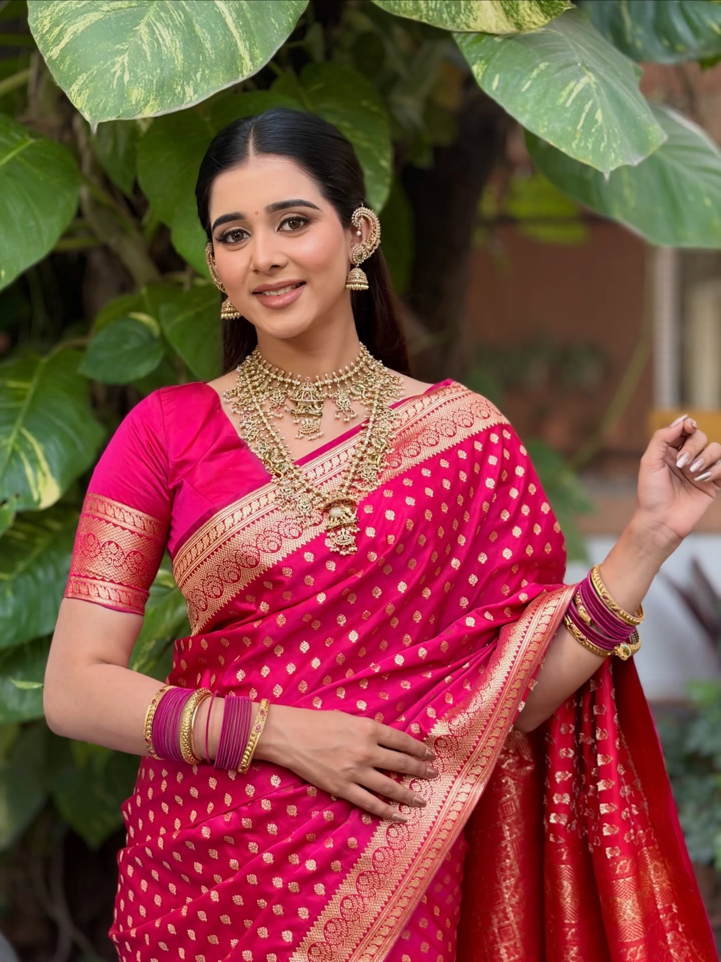 Bride with wedding makeup, hairstyling and draping by Tejaswini