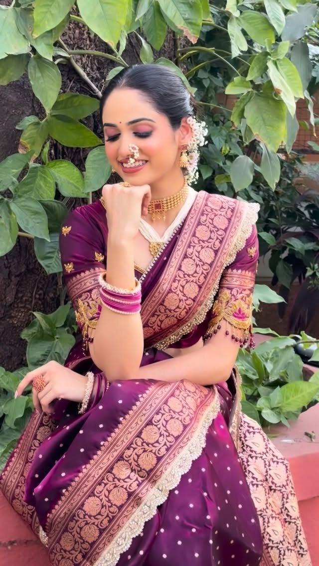 Marathi bride in purple Paithani with classic bridal makeup