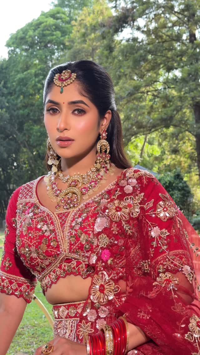 Classic red bridal look for a North Indian wedding, makeup by Tejaswini
