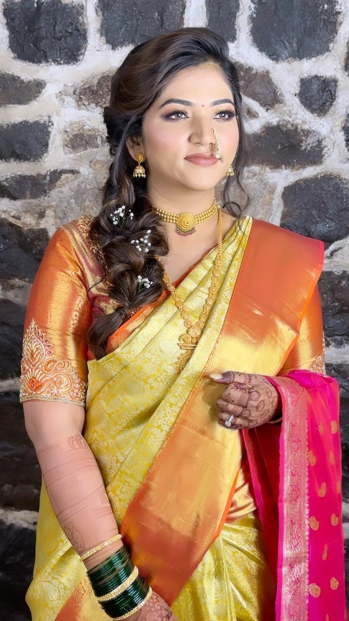 Close-up of the bridal makeup finish against a stone wall at Fort JadhavGadh, Pune, by Tejaswini Gote