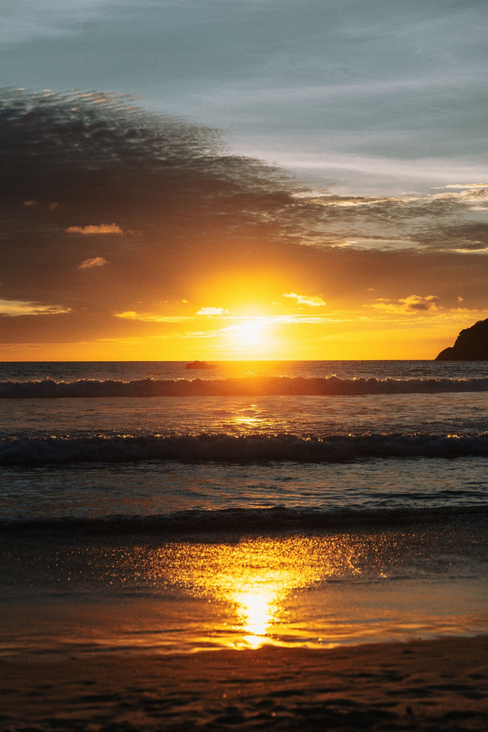 Sunset over Kata Beach, a popular ceremony setting in Phuket