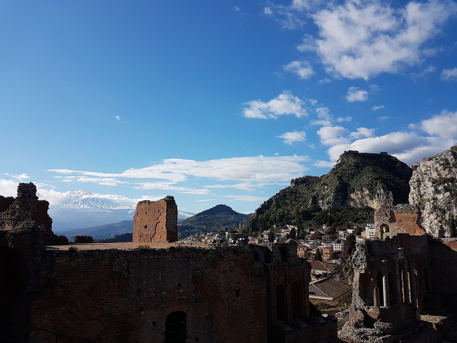 The Greek theatre of Taormina with Mount Etna