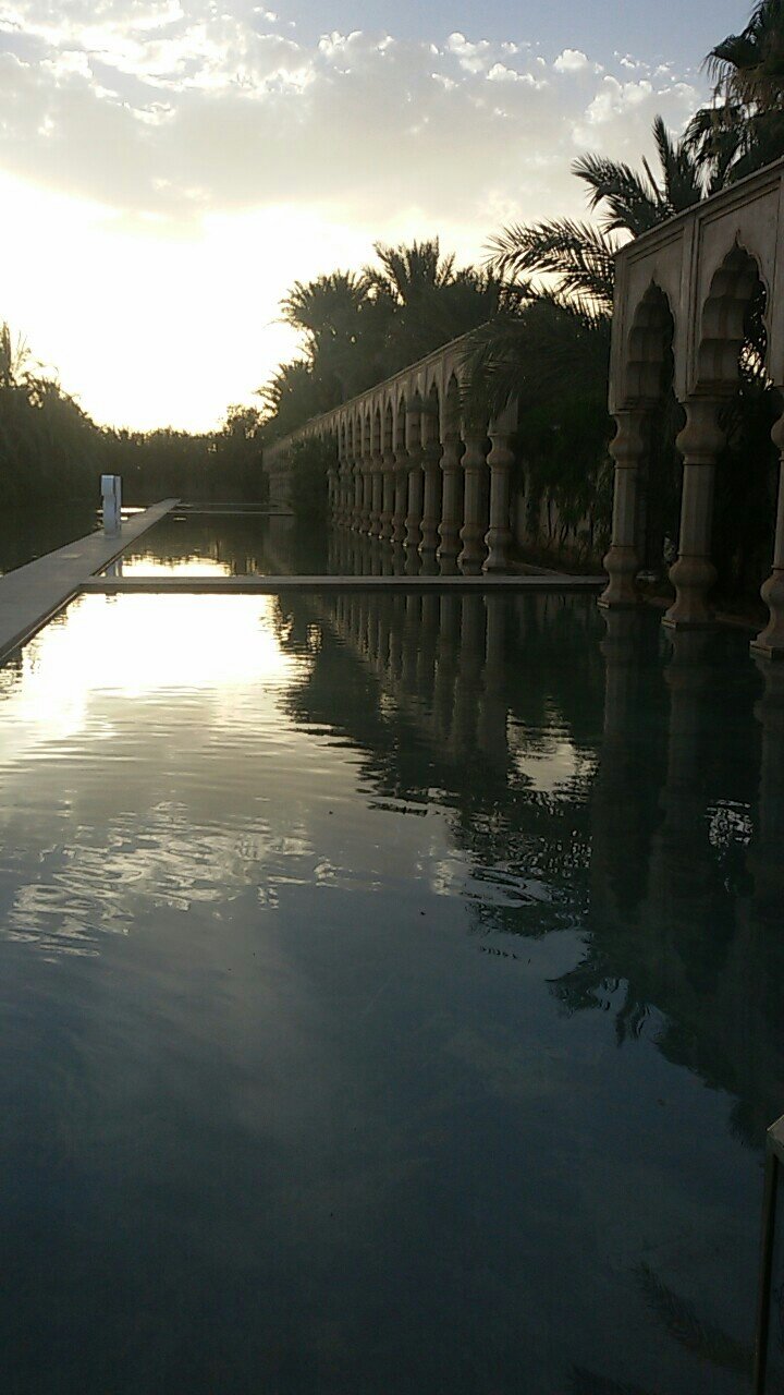 Palais Namaskar — reflecting pool by night